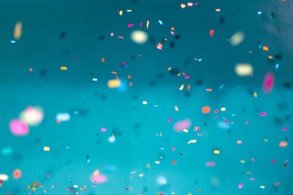 Confetti on turquoise background